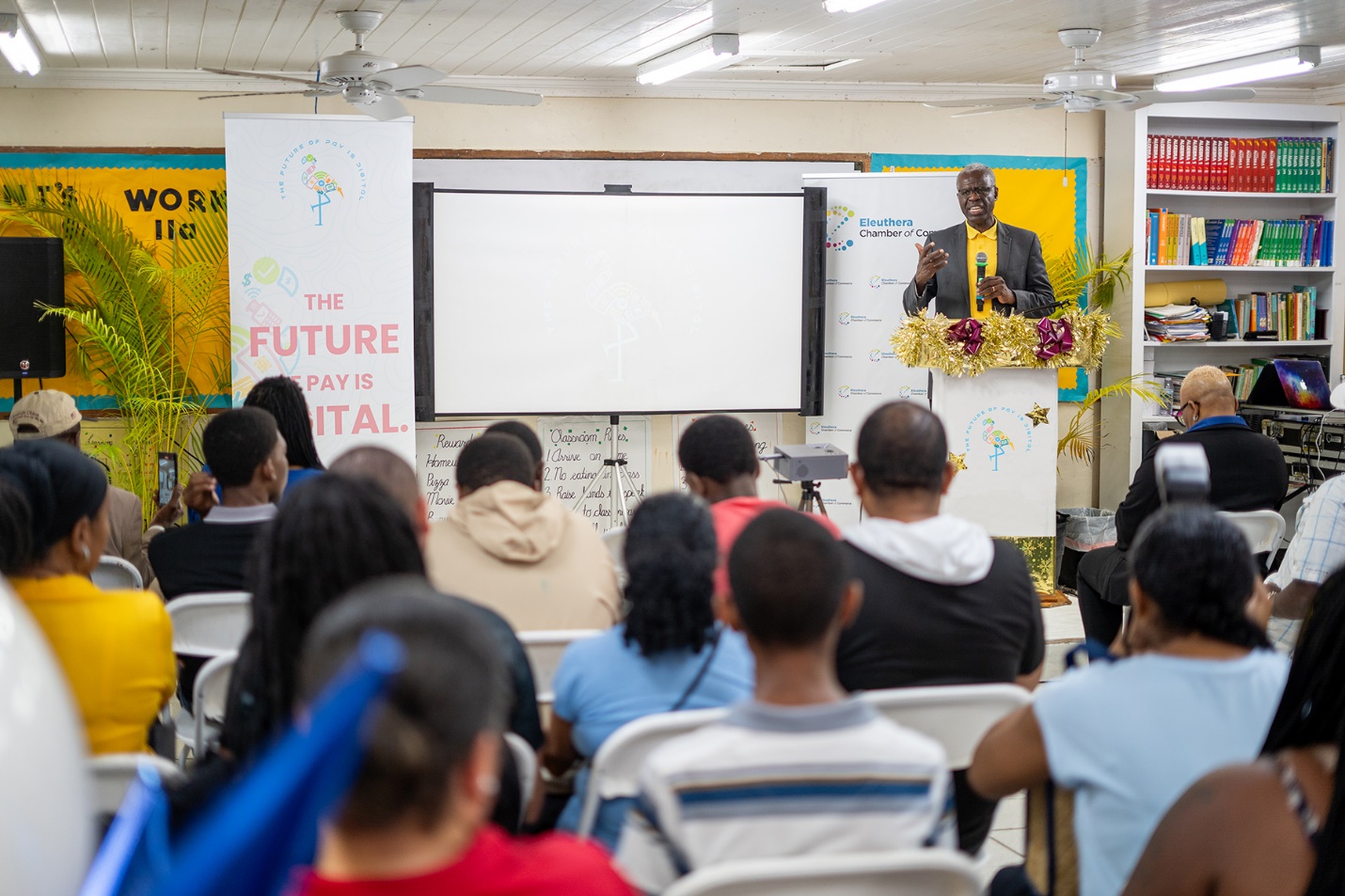A person standing in front of a white board

Description automatically generated